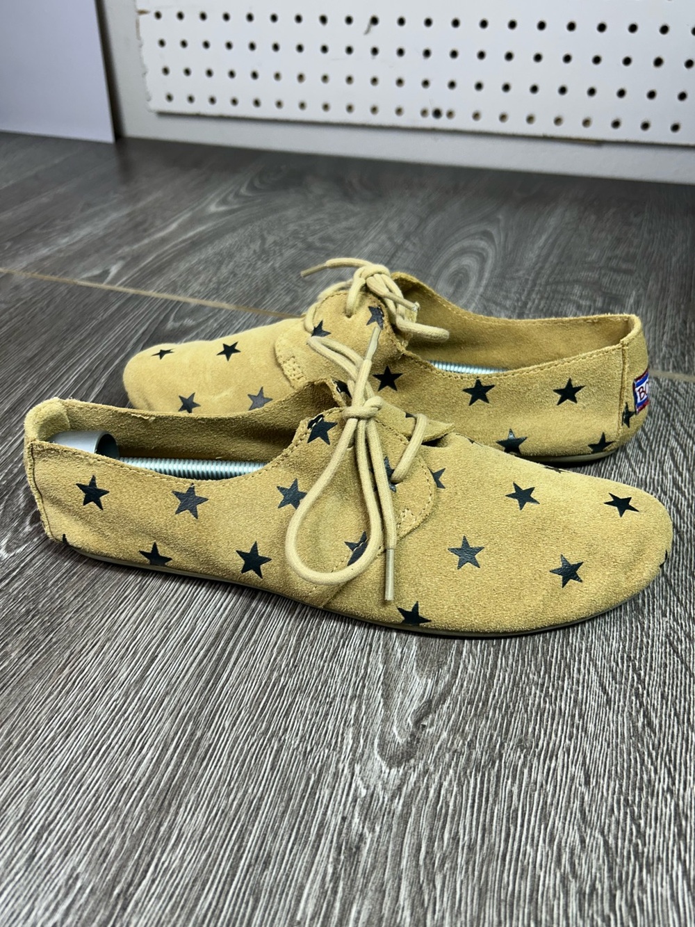 Skechers women’s Yellow Star-Print Moccasin Lace-Up Shoes
